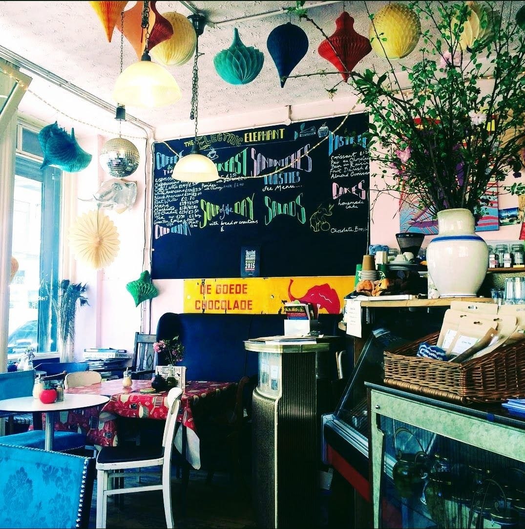 Colourful interior, decorated with paper lanterns and a largevase with fresh flowers